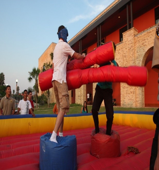 Students jousting during Late Night at the Rec. 