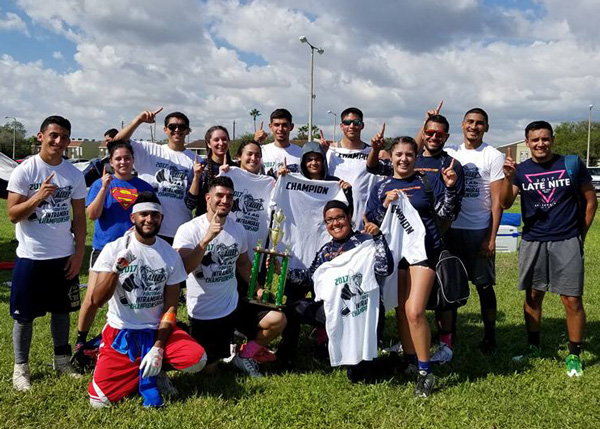 Members of the TSC Scorpions co-ed flag football team celebrate after winning the Valley Bowl championship on Oct. 14, 2017 at Edinburg.