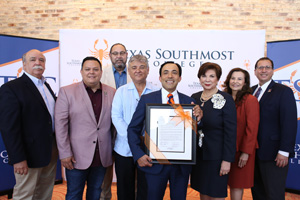 The TSC Board of Trustees honored Board Chair and City of Brownsville Mayor Elect, Trey Mendez, with a resolution during the June 27, 2019 regular meeting. From left, TSC Trustee Art Rendon, Trustee J.J. De Leon Jr., Trustee Tony Zavaleta, Ph.D., TSC Board Secretary Ruben Herrera, TSC Board Vice Chair Trey Mendez, TSC Board Chair Adela G. Garza, Trustee Eva Alejandro, and TSC President Jesús Roberto Rodríguez, Ph.D.